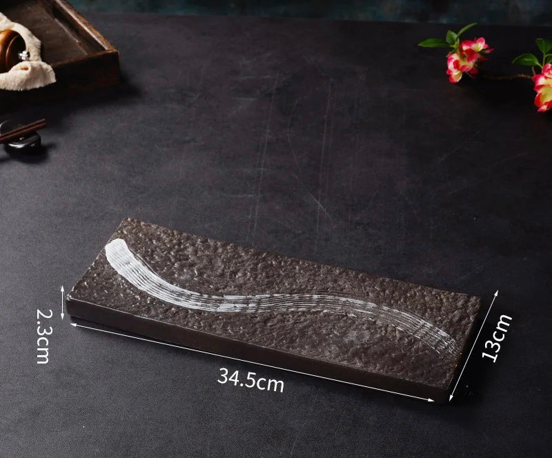 Nisu Home Ichi Dishes in a rectangular shape with a sleek black design and artistic white detail