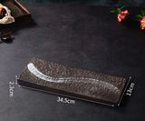 Nisu Home Ichi Dishes in a rectangular shape with a sleek black design and artistic white detail