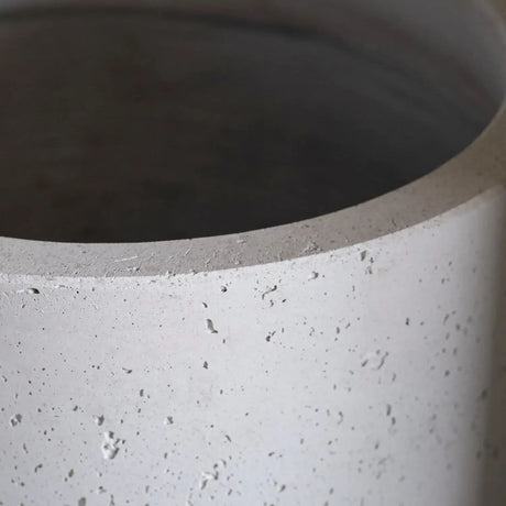 Close-up of a textured grey Cylinder Planter from Jobu Home with a modern design