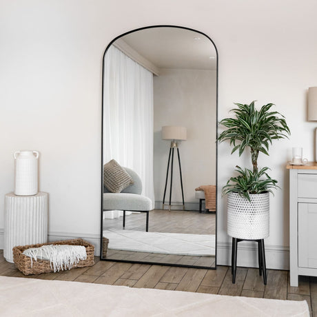 Stylish Jobu Home Arch Mirror with a sleek black frame, enhancing the modern living space