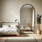 Jobu Home Arched Mirror in a stylish bedroom setting with minimalist decor and soft lighting