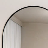 Elegant Arched Mirror by Jobu Home with a sleek black frame for stylish home decor