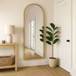 Jobu Home Arched Mirror with a sleek gold frame, enhancing a contemporary hallway decor