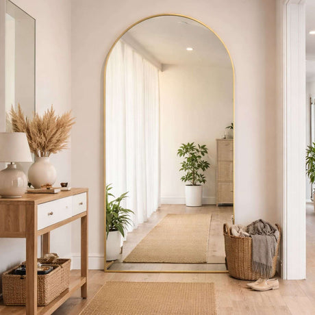 Jobu Home Arched Mirror in a stylish entryway with natural light and decorative elements