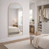 Elegant Arched Mirror with a gold frame, perfect for enhancing bedroom decor and natural light