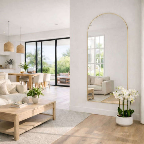 Jobu Home Arched Mirror in a modern living room reflecting natural light and decor