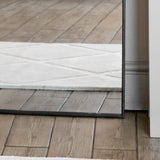 Jobu Home Arched Mirror with a sleek black frame, perfect for modern interior decor