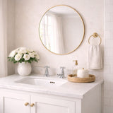 Elegant Circle Mirror with a Gold Frame, Perfect for Enhancing Bathroom Decor