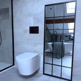 Jobu Home Grid Mirror with a black frame, reflecting a stylish bathroom setting