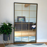 Jobu Home Grid Mirror with a sleek black frame and gold grid design, perfect for home decor