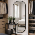 Stylish Oval Mirror by Jobu Home in a modern bedroom setting with natural light