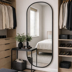 Stylish Oval Mirror by Jobu Home in a modern bedroom setting with natural light