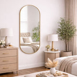 Stylish Jobu Home Oval Mirror with a gold frame, perfect for enhancing modern interiors