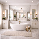 Jobu Home Rectangle Mirror above a modern freestanding bathtub in an elegant bathroom setting