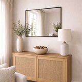 Jobu Home Rectangle Mirror with a sleek black frame in a stylish living room setting