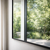 Elegant Rectangle Mirror from Jobu Home reflecting a garden view with a sleek black frame