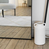Jobu Home Rectangle Mirror with a sleek black frame reflecting a stylish interior setting