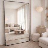 Large Rectangle Mirror by Jobu Home reflecting a stylish, modern living room interior