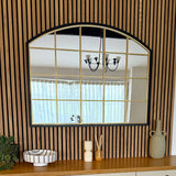 Jobu Home Window Mirror with an Arched Design and Gold Framed Grid on a Wooden Wall