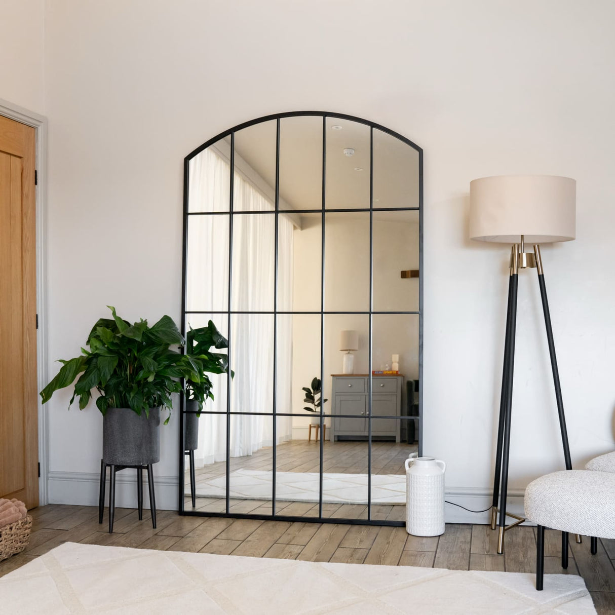Jobu Home Window Mirror with an elegant arched design, ideal for enhancing modern interior spaces