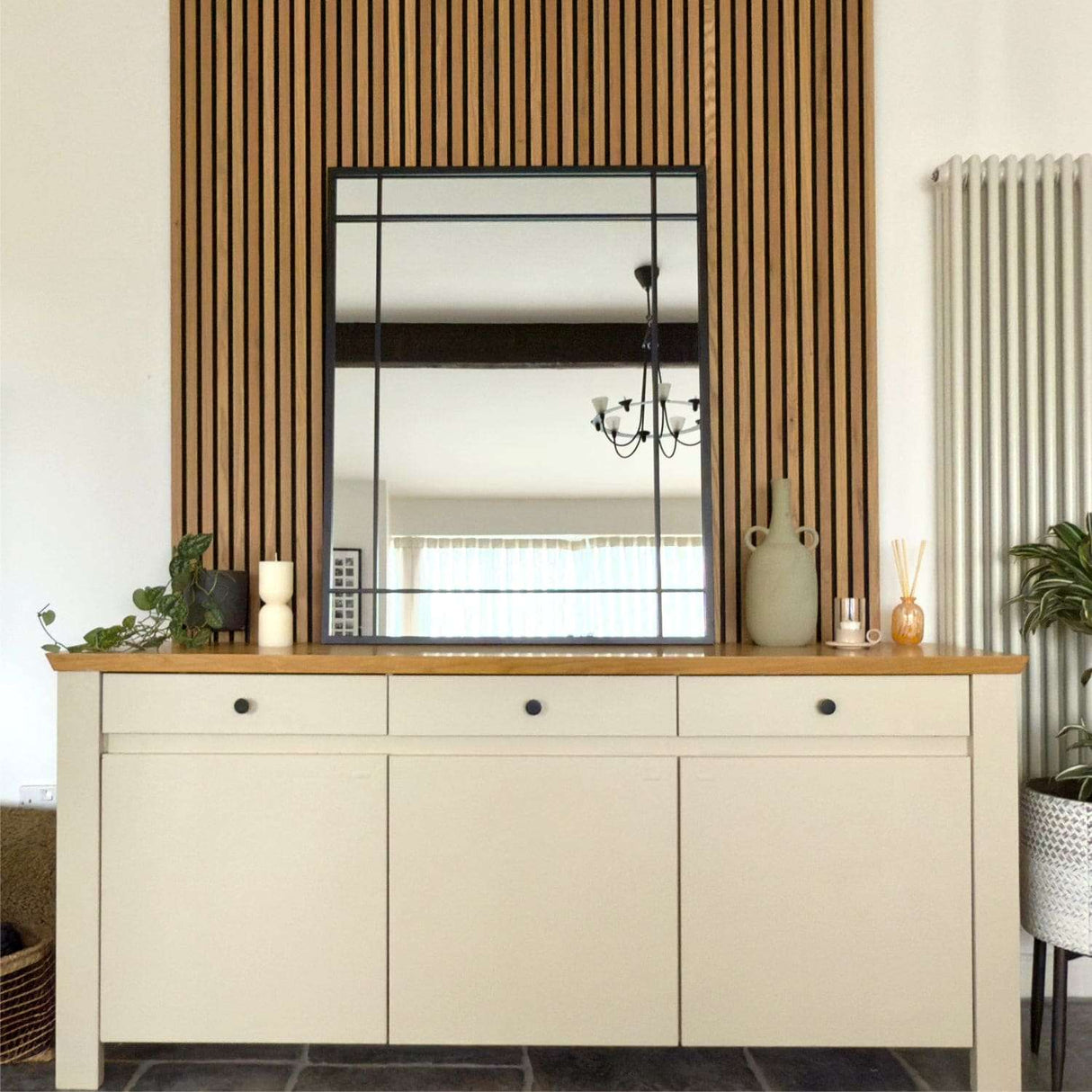 Jobu Home Window Mirror above a stylish sideboard with wooden accents in a modern interior