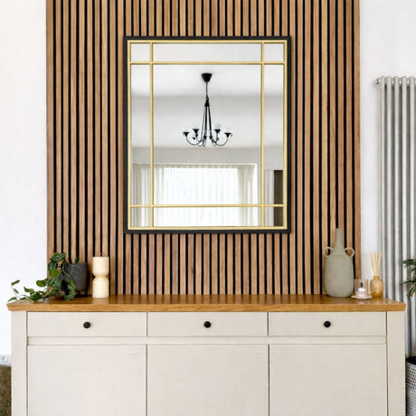Stylish Jobu Home Window Mirror with a sleek gold frame on a wooden slatted wall