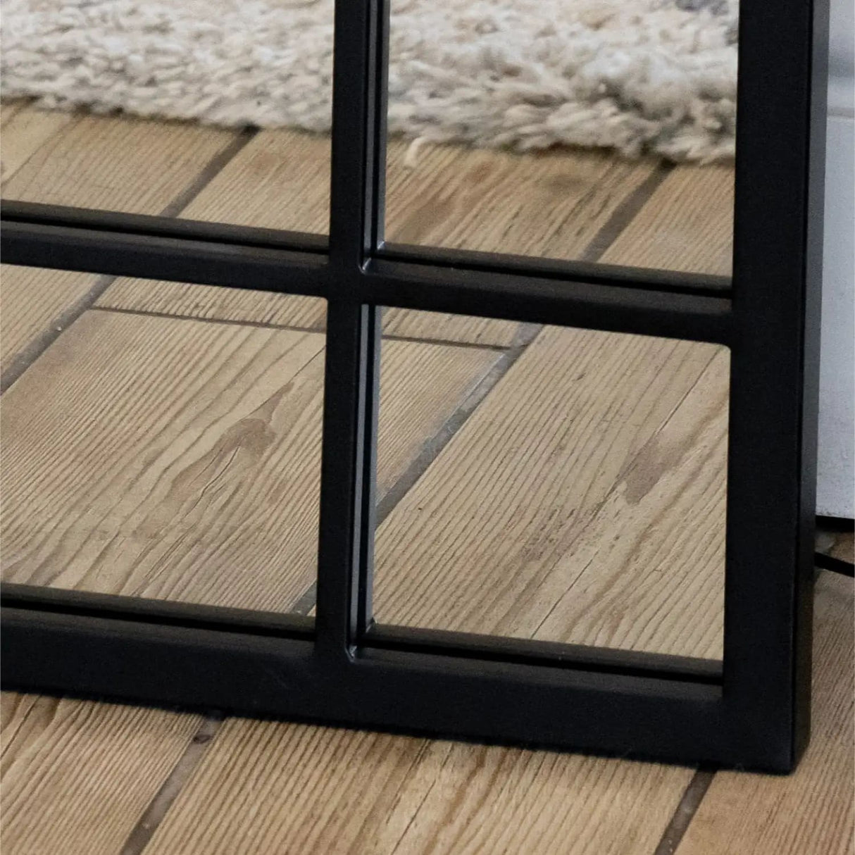 Jobu Home Window Mirror with a stylish black frame, perfect for home decor and enhancing natural light