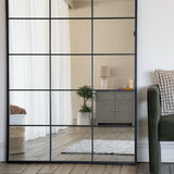 Lattice Grid Mirror by Jobu Home with a sleek design reflecting a bright interior space