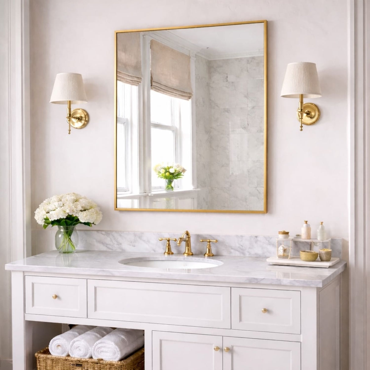 Elegant Rectangle Mirror with a Gold Frame Above a Marble Vanity in a Stylish Bathroom