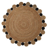Orsina Jute Rug in a round shape with contrasting black pom-poms for a stylish natural decor