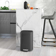 Sleek black Kitchen Bin with pedal for easy opening in a modern kitchen setting