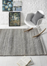 Stylish knitted rug in grey tones, perfect for enhancing modern living spaces