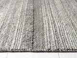 Textured grey Knitted Rug with a striped pattern for a stylish home decor accent