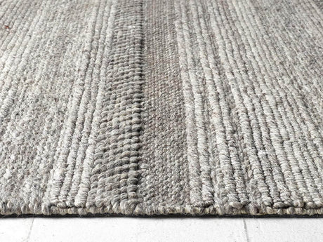 Textured grey Knitted Rug with a striped pattern for a stylish home decor accent