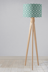 Shadow Bright Lampshade with a geometric pattern on a wooden tripod floor lamp