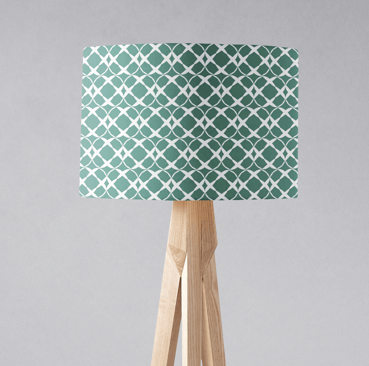 Shadow Bright stylish green patterned lampshade on a wooden tripod lamp base