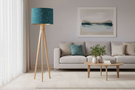 Stylish blue geometric lampshade on a wooden floor lamp in a modern living room setting