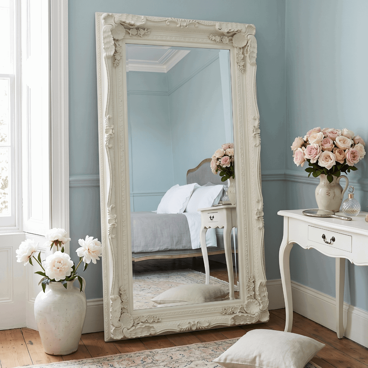 Elegant Leaner Mirror with Ornate White Frame in Stylish Bedroom Setting