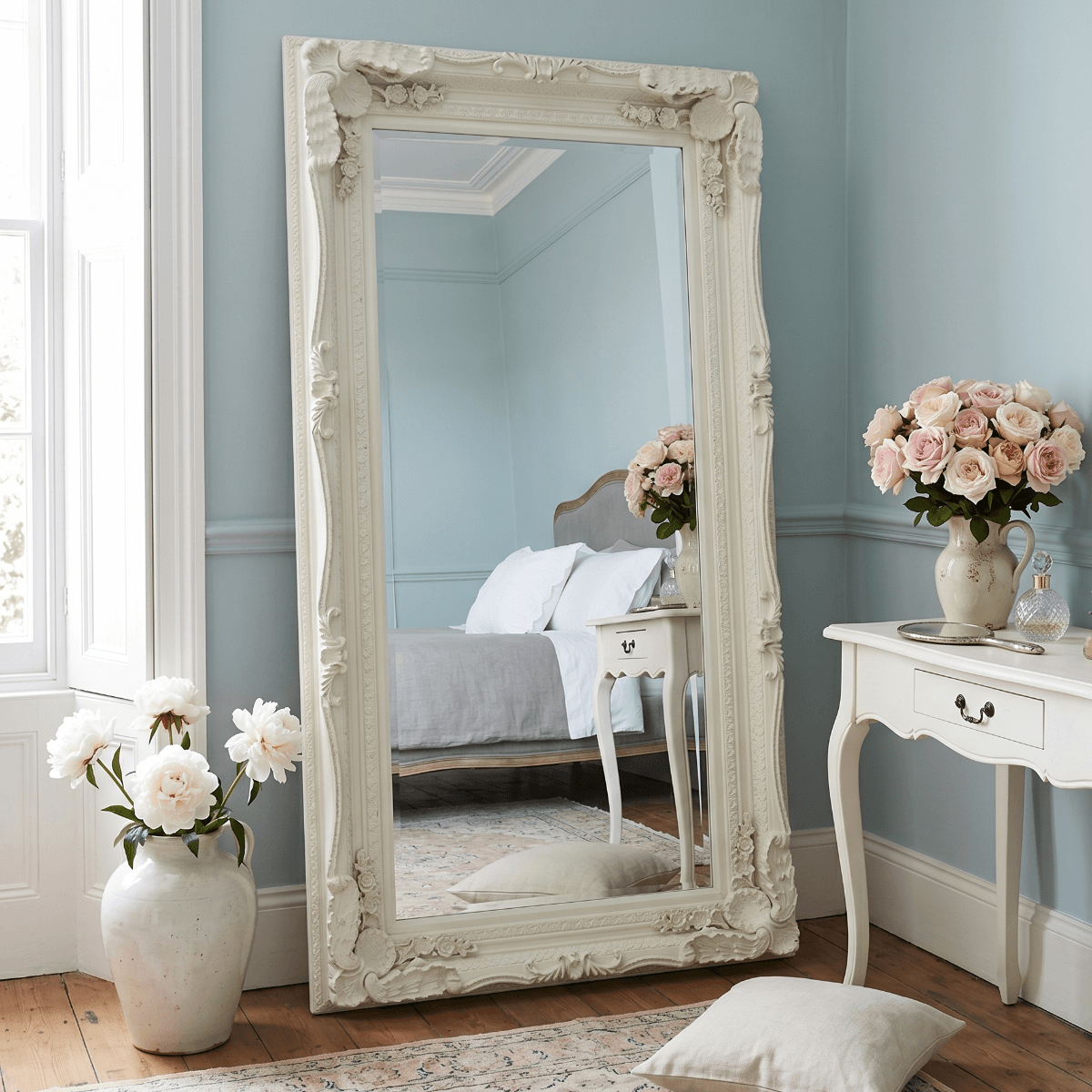 Elegant Leaner Mirror with Ornate White Frame in Stylish Bedroom Setting