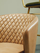 Stylish Orsina Leather Chair with a quilted design for elegant living spaces