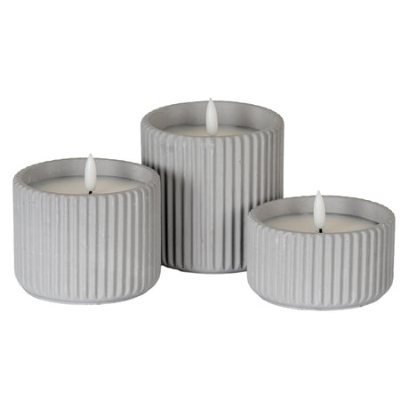 Set of three grey ribbed LED Candles in assorted sizes for home decor and ambiance