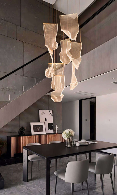 Elegant Nisu Home Light Pendant featuring flowing designs, perfect for modern dining spaces