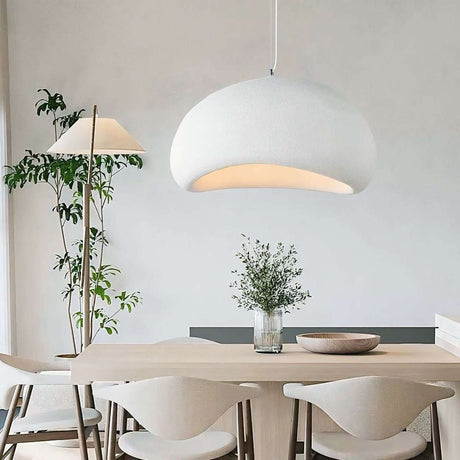 Nisu Home Light Pendant in a modern dining space with a wooden table and stylish decor