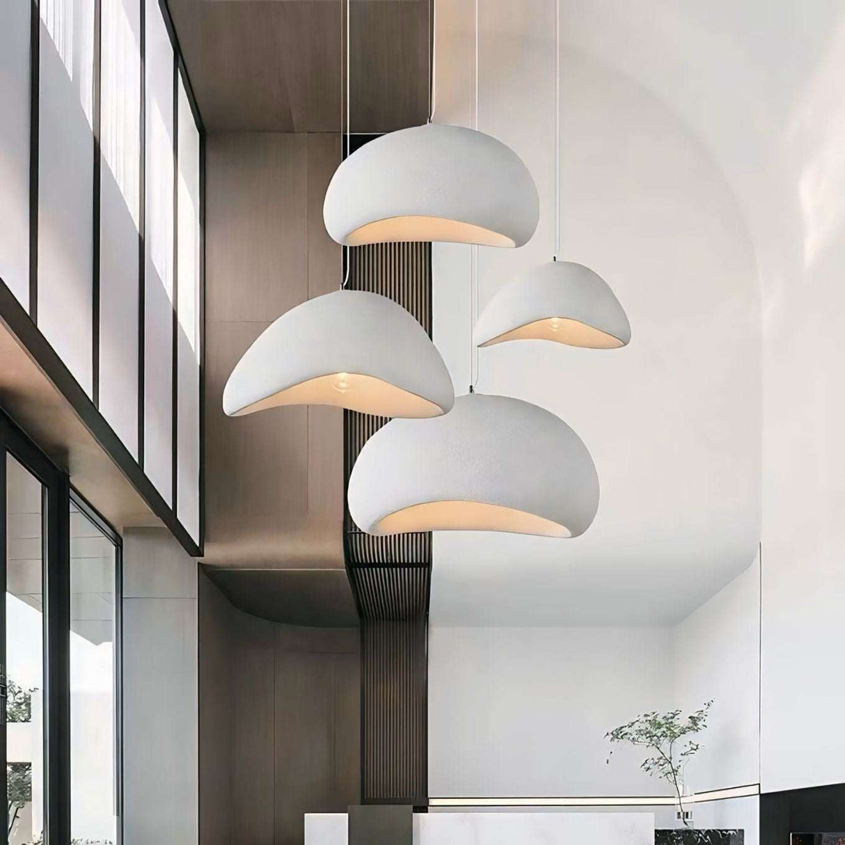 Nisu Home Light Pendant with a modern design featuring four curved shades for stylish indoor lighting