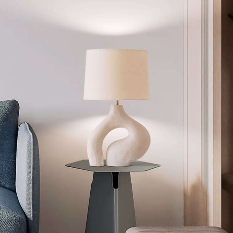 Modern decorative lamp with a unique base and soft shade, ideal as a light pendant in stylish interiors
