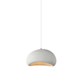Nisu Home Light Pendant in a modern design with a soft white finish and warm interior glow