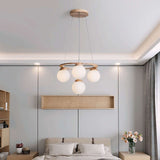 Nisu Home Light Pendant featuring four frosted globes for elegant bedroom lighting