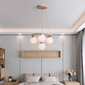 Nisu Home Light Pendant featuring four frosted globes for elegant bedroom lighting