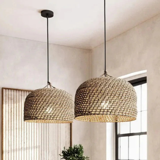 Nisu Home Light Pendant in woven rattan design creating a warm, ambient glow in modern interiors