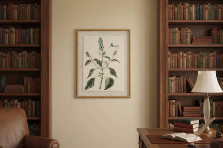 Framed Linen Artwork featuring botanical illustration in a warm library setting with bookshelves